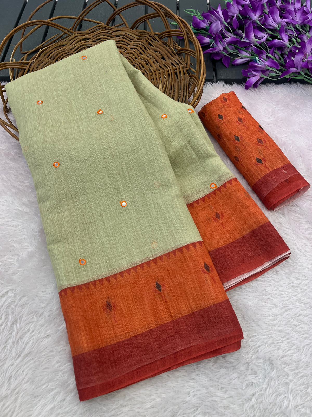 Amthi Linen Lotus Print Pista & Rust Mirror Tassels Pallu Saree