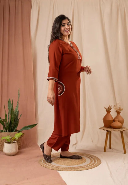 Amthi Women's Rust Rayon Embroidered Straight Kurta Pant Set