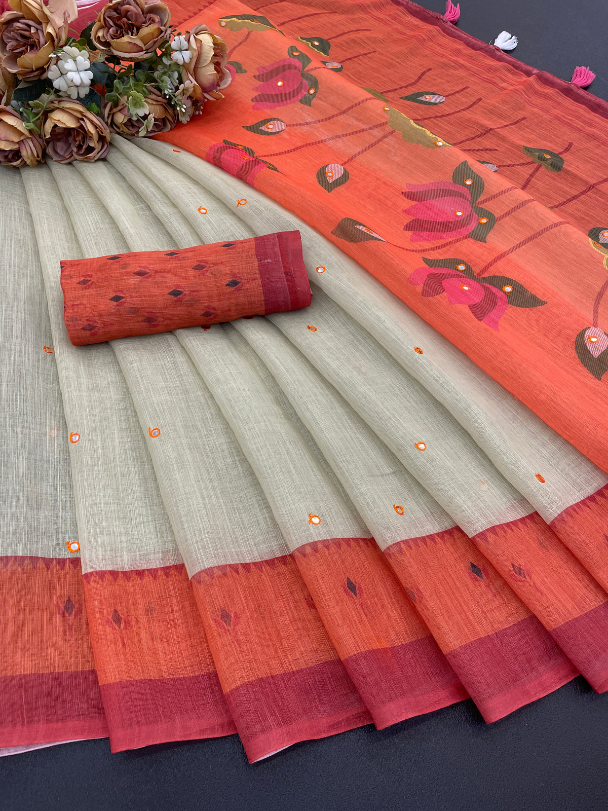 Amthi Linen Lotus Print Pista & Rust Mirror Tassels Pallu Saree